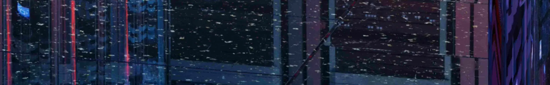 A close-up view of a modern data center with rows of servers illuminated by blue and red lights, reflecting a digital aesthetic. The image shows a slightly blurred effect, suggesting movement or activity.