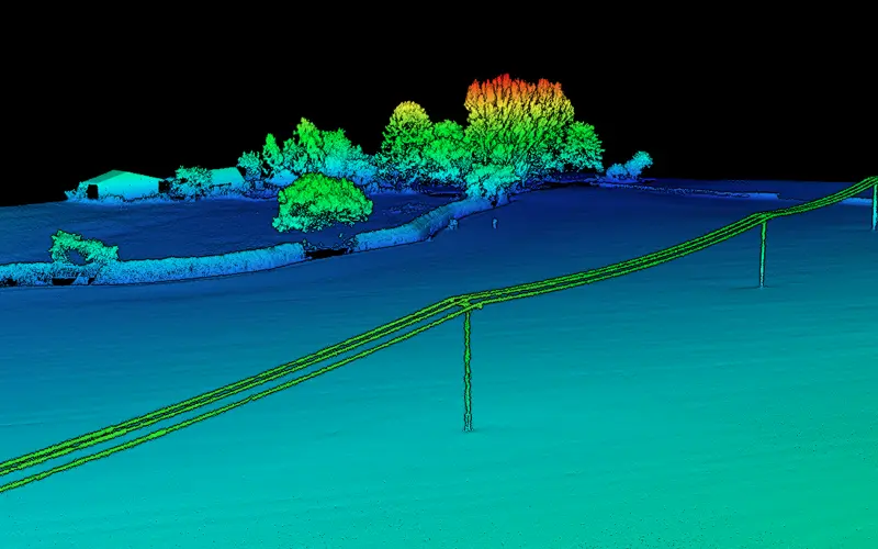 A digital elevation model depicting a landscape with a fence, trees, and a building, all represented in vibrant colors against a black background. Power lines run across the foreground.