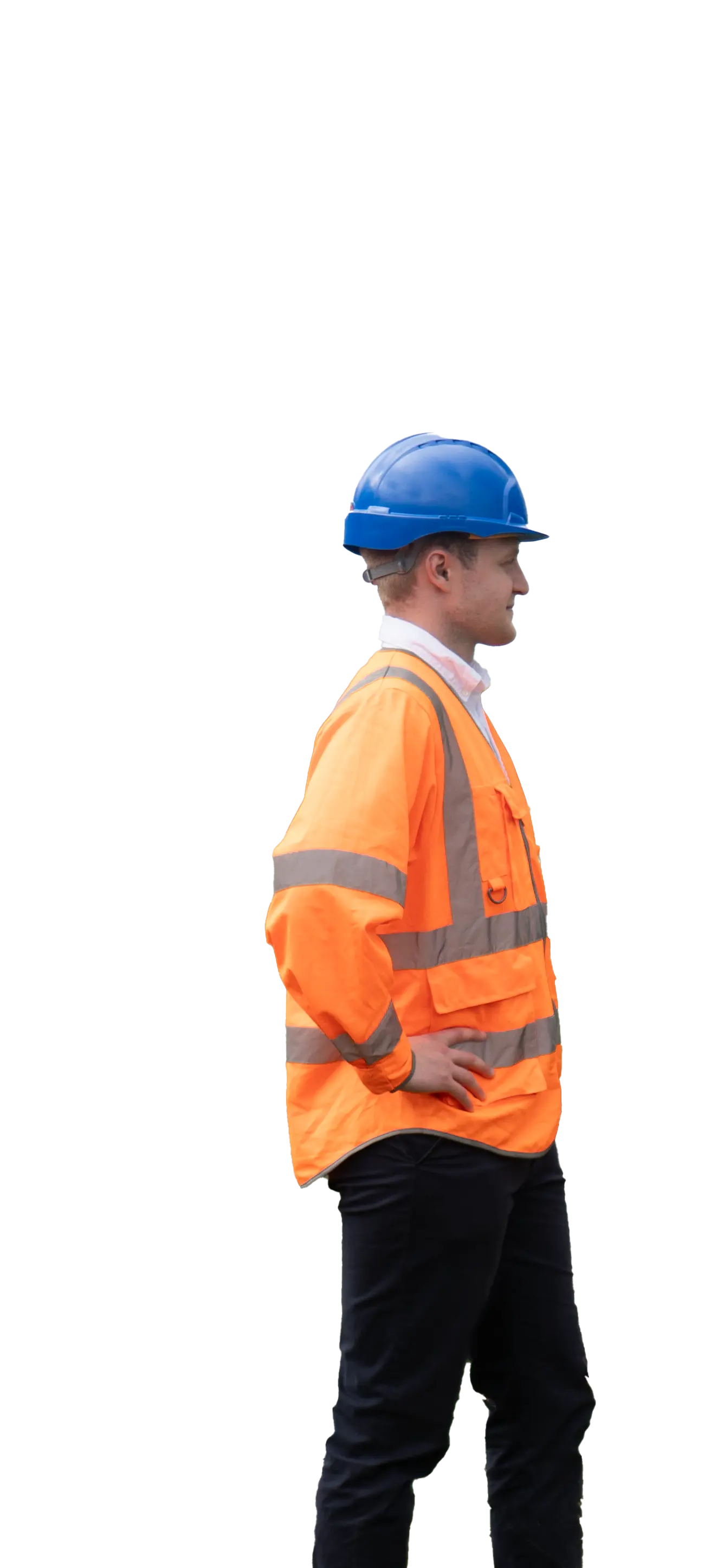 A man wearing an orange safety jacket with reflective stripes and a blue hard hat, standing sideways with hands on hips against a plain background.